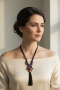 Necklace with a colorful bead on a beige background