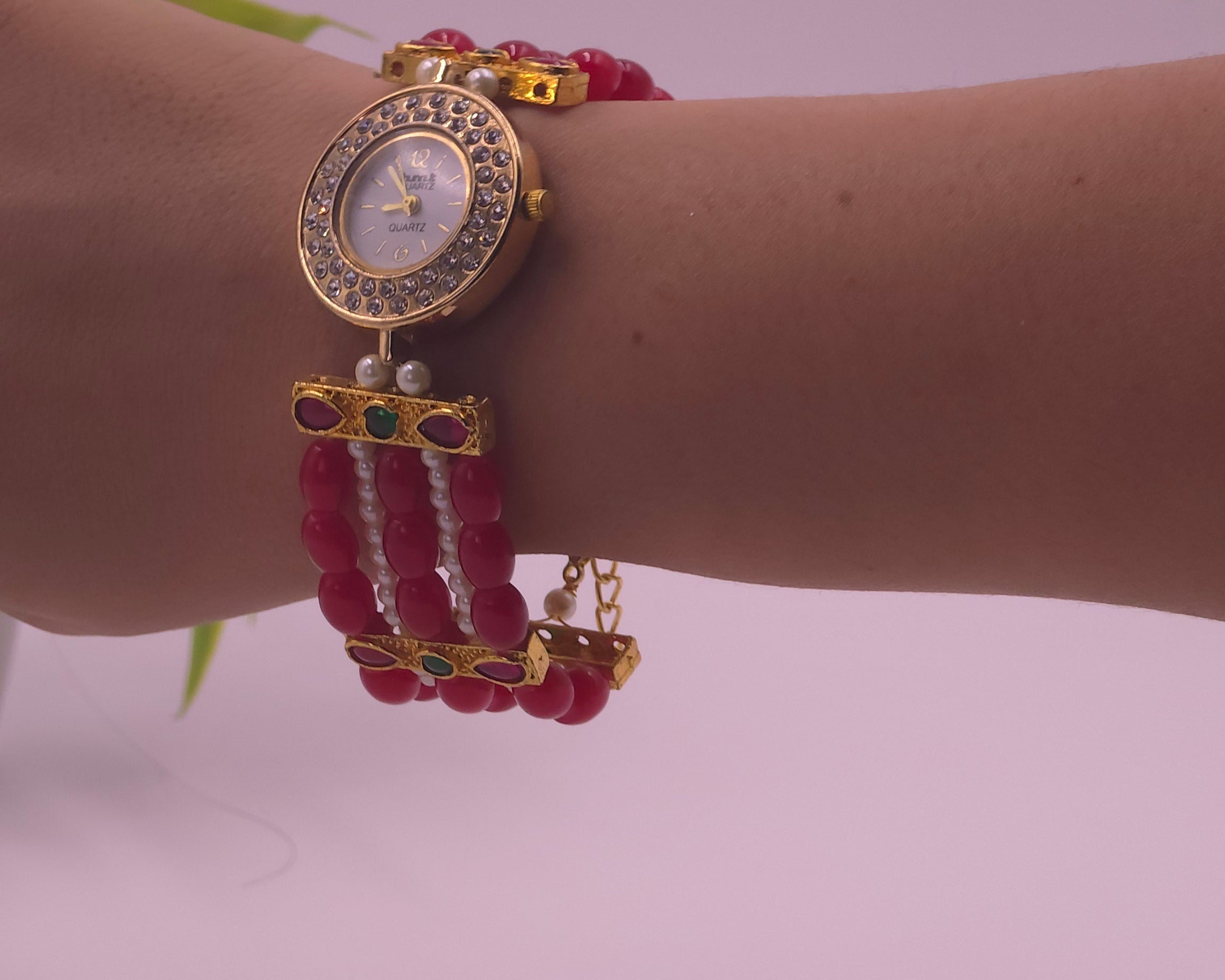 Watch with red beads