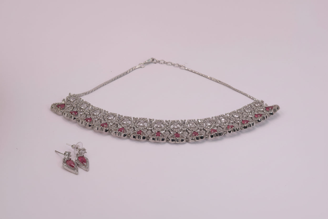 White ad with heart shaped pink stone